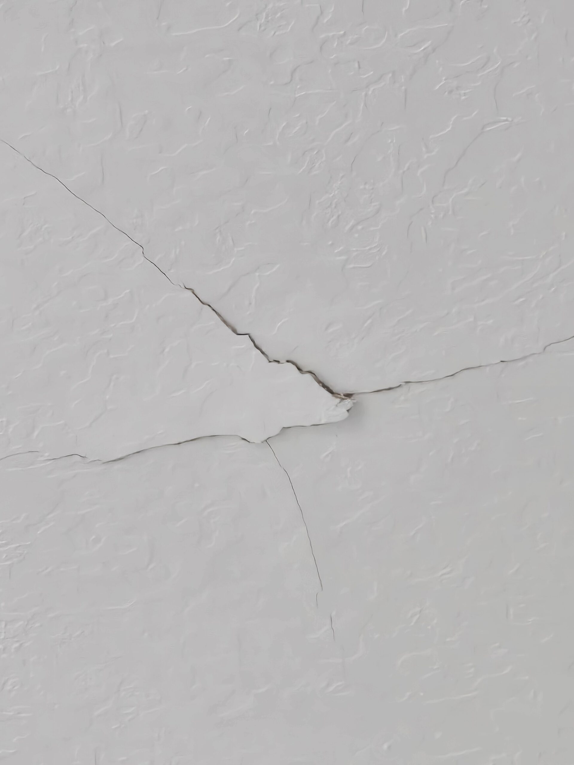 Ceiling drywall crack repair and texture preparation in a Utah home