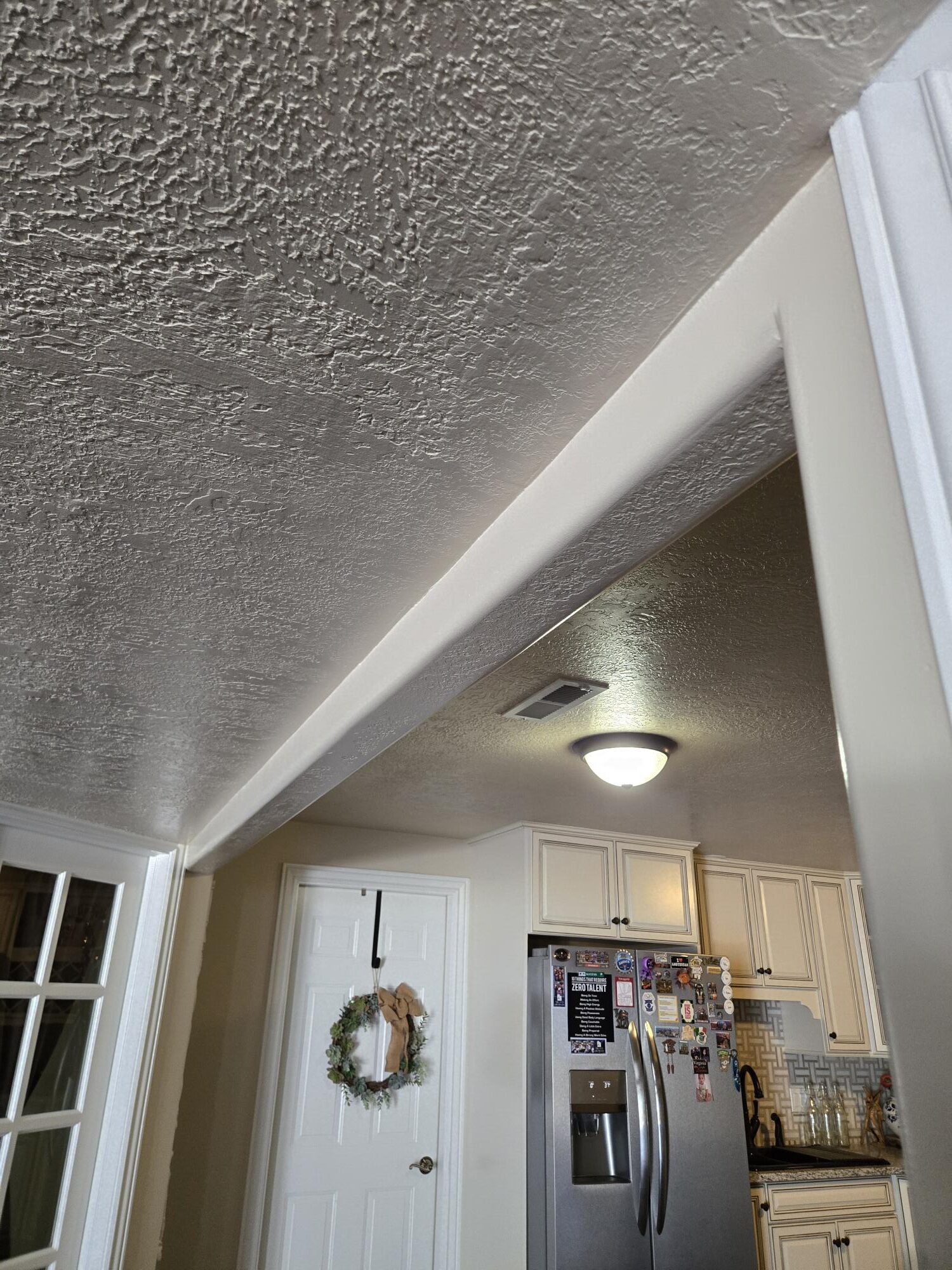 Finished drywall water damage repair with blended ceiling texture in Northern Utah