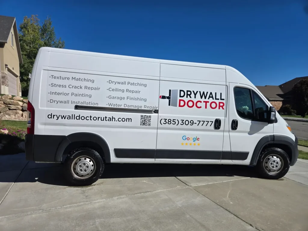 Drywall Doctor Utah service van with the company logo, phone number (385) 309-7777 and a list of drywall repair services