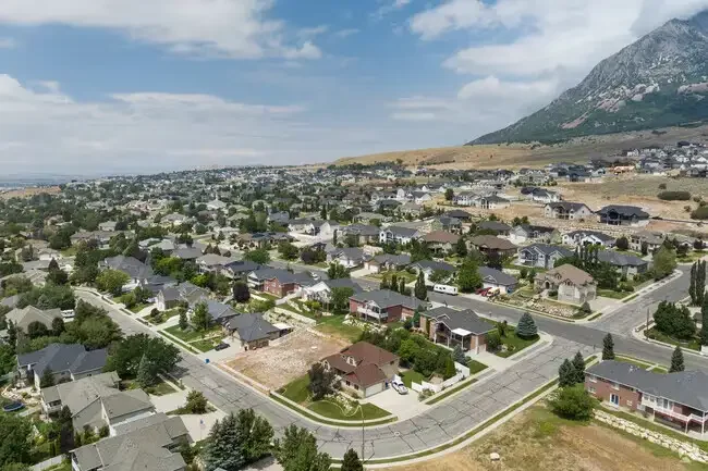 Aerial view of homes on the North Ogden, Utah bench below the mountains