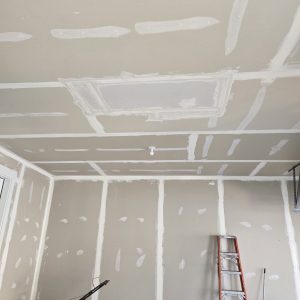 Large ceiling drywall patch and professional taping in a residential garage, performed by The Drywall Doctor in Pleasant View, Utah.