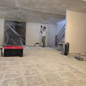 Professional skim coating for a Level 5 drywall finish in a Utah home.